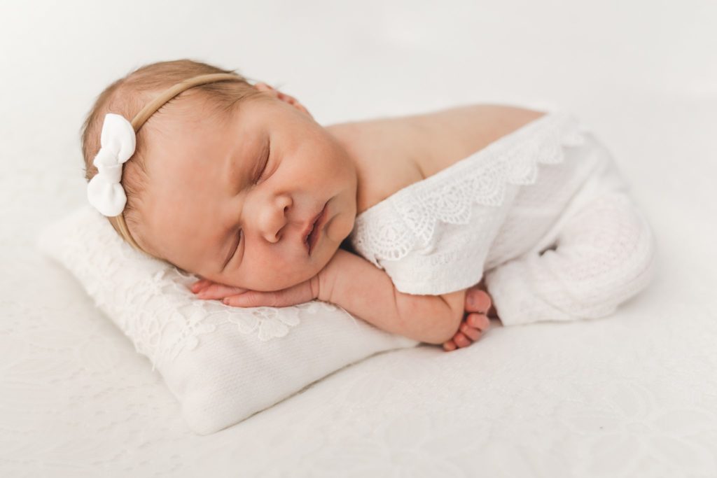 newborn sleeps on a pillow