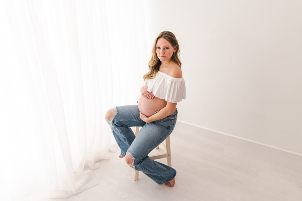 Pregnant woman on stool