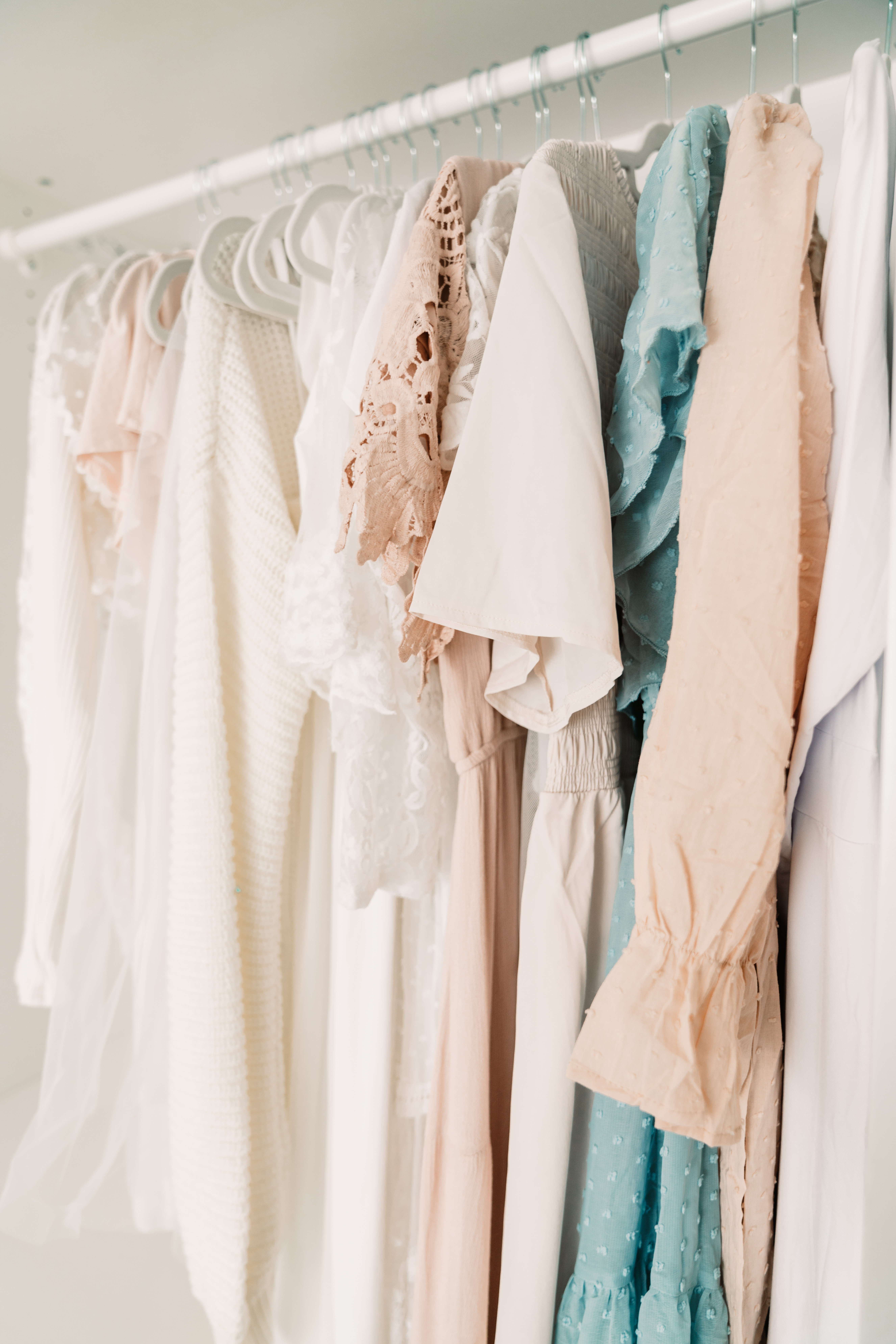 Photo of dresses hanging on a rack Prepare for a Successful Newborn Photoshoot