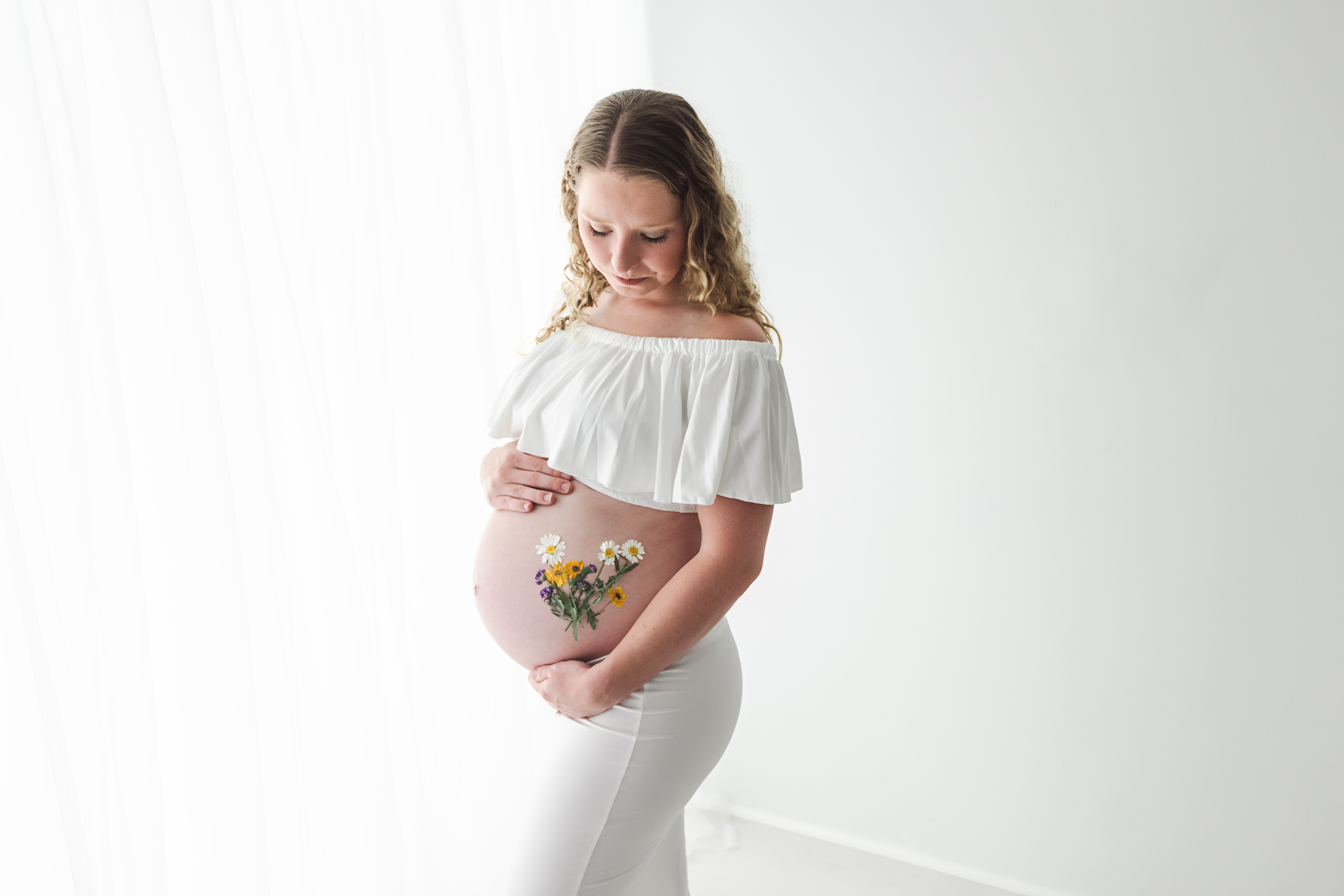 Flowers on belly maternity photo